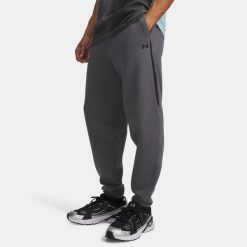 UA Unstoppable Fleece Spodnie Dresowe Męskie Szare. Szare spodnie sportowe męskie Under Armour, m, bez wzorów, z bawełny, na fitness i siłownię. Za 599.99 zł.