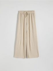 Szerokie spodnie z dzianiny - beżowy. Brązowe spodnie materiałowe damskie Reserved, l, bez wzorów, z dzianiny. W wyprzedaży za 59.99 zł.