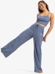 Spodnie sportowe damskie RISE & VIBE. Niebieskie spodnie sportowe damskie Roxy, s, bez wzorów, z elastanu, na fitness i siłownię. Za 346.05 zł.