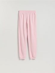 Spodnie dresowe long leg - pastelowy róż. Czerwone spodnie dresowe damskie Reserved, l, bez wzorów, z bawełny. Za 79.99 zł.