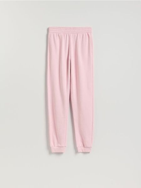 Spodnie dresowe long leg - pastelowy róż. Czerwone spodnie dresowe damskie Reserved, l, bez wzorów, z bawełny. W wyprzedaży za 49.99 zł.