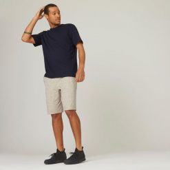 Koszulka z krótkim rękawem męska Domyos Gym & Pilates 500 regular. Niebieskie koszulki sportowe męskie DOMYOS, m, bez wzorów, z bawełny, bez kołnierzyka, bez ramiączek, na fitness i siłownię. W wyprzedaży za 29.99 zł.