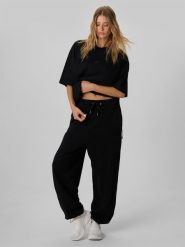 4F Regular Size: Spodnie dresowe joggery 4F | Tomasz Fornal - czarne L. Czarne spodnie sportowe męskie 4f, l, bez wzorów, z dresówki, na fitness i siłownię. Za 199.99 zł.