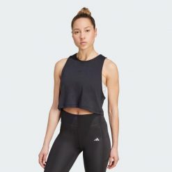 Koszulka Yoga Essentials Cropped. Czarne koszulki sportowe damskie Adidas, bez wzorów, bez kołnierzyka, bez ramiączek, na jogę i pilates, climacool (adidas). Za 129.00 zł.