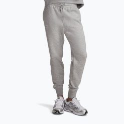 Spodnie damskie Under Armour Icon Fleece Jogger. Szare spodnie materiałowe damskie Under Armour, bez wzorów, na fitness i siłownię. Za 169.99 zł.