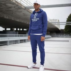 Champions League spodnie dresowe dla dorośli. Niebieskie spodnie sportowe męskie CHAMPIONS LEAGUE, l, bez wzorów, z bawełny, do piłki nożnej. Za 168.99 zł.