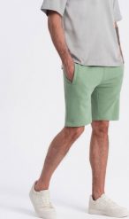 Ombre Męskie spodenki dzianinowe ze ściągaczem i kieszeniami - zielone V3 OM-SRBS-0139 XL. Zielone krótkie spodenki sportowe męskie Ombre, m, bez wzorów, z dzianiny. Za 49.99 zł.