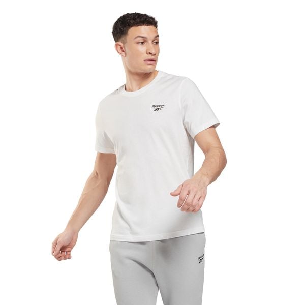 Koszulka Reebok Identity Classic Left Chest Logo. Białe buty sportowe męskie Reebok, m, bez wzorów, z bawełny, bez kołnierzyka, bez ramiączek, na fitness i siłownię. Za 73.99 zł.