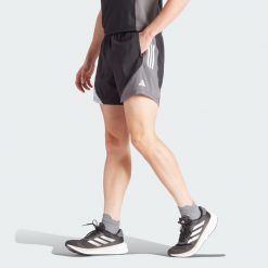 Szorty Own The Run Colorblock. Brązowe buty sportowe męskie Adidas, z materiału, bez zapięcia, na fitness i siłownię. Za 166.45 zł.