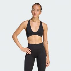Dzianinowy biustonosz Workout Essentials o lekkim wsparciu. Czarne obuwie sportowe damskie Adidas, bez wzorów, z dzianiny, na fitness i siłownię. Za 199.00 zł.
