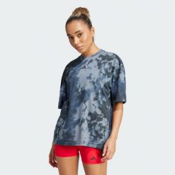 Koszulka Climacool Training Club 24/7 Graphic. Fioletowe koszulki sportowe damskie Adidas, s, bez wzorów, sportowe, bez kołnierzyka. Za 149.99 zł.
