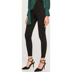 Legginsy z lampasem - Wielobarwn. Szare legginsy damskie Reserved. Za 69.99 zł.