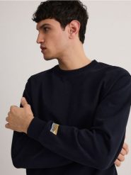 Bawełniana bluza z naszywką - granatowy. Niebieskie bluzy męskie Reserved, l, z aplikacjami, z bawełny, bez kaptura. W wyprzedaży za 79.99 zł.