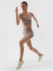 4F Legginsy krótkie treningowe z materiału z recyklingu damskie - beżowe XL. Brązowe legginsy damskie 4f, l, bez wzorów, z dzianiny. W wyprzedaży za 39.99 zł.