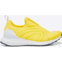 Adidas by Stella McCartney - Buty Ultra Boost Uncaged. Białe obuwie sportowe damskie adidas by Stella McCartney, z gumy. W wyprzedaży za 699.90 zł.