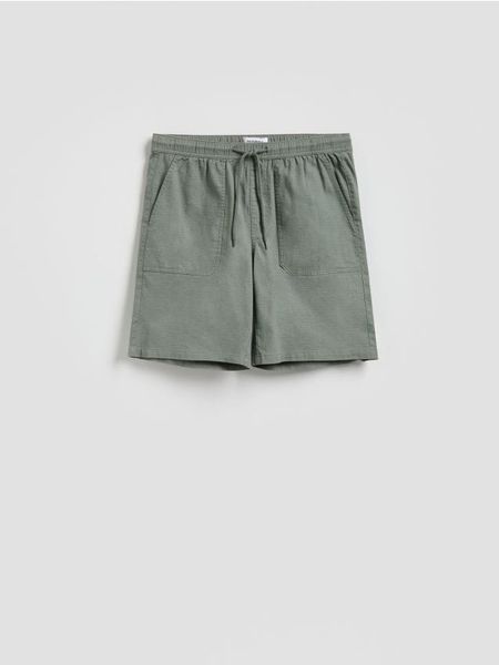 Szorty jogger regular fit - jasny zielony. Zielone szorty męskie Reserved, l, bez wzorów, z bawełny. Za 119.99 zł.