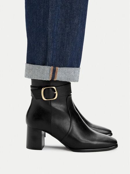 MEXX Botki CEO-26F816-2A Czarny. Czarne botki damskie Mexx, ze skóry, bez obcasa, na słupku, bez zapięcia. Za 259.99 zł.