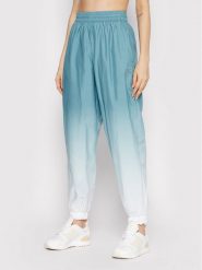Adidas Spodnie dresowe adicolor 3D Trefoil GN2850 Zielony Loose Fit. Zielone spodnie dresowe damskie Adidas, bez wzorów, z dresówki. Za 379.99 zł.