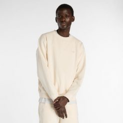 Bluza męska New Balance MT41506PEF – beżowa. Brązowe bluzy męskie New Balance, m, z aplikacjami, z bawełny, bez kaptura. Za 359.99 zł.