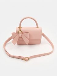 Torebka z kokardą i ozdobną zawieszką w kształcie serca - różowy. Czerwone torebki do ręki damskie Sinsay, bez wzorów, bez dodatków. Za 39.99 zł.