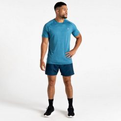 Koszulka Dare 2B Persist. Niebieskie koszulki sportowe męskie Dare 2b, bez wzorów, bez kołnierzyka, bez ramiączek, do biegania. Za 151.50 zł.