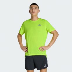 Koszulka adi365Breeze Running. Żółte koszulki sportowe męskie Adidas, bez wzorów, bez kołnierzyka, bez ramiączek, do biegania, climacool (adidas). Za 179.00 zł.