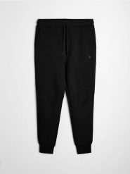 Spodnie tapered fit SNSY PERFORMANCE - czarny. Czarne spodnie sportowe męskie Sinsay, l, bez wzorów, na fitness i siłownię. Za 59.99 zł.
