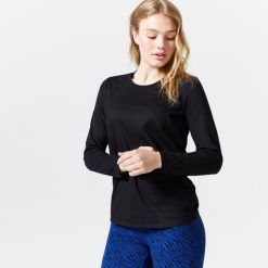 Koszulka z długim rękawem damska Domyos Gym & Pilates 100. Czarne koszulki sportowe damskie NYAMBA, s, bez wzorów, z bawełny, bez kołnierzyka, bez ramiączek, na jogę i pilates. Za 39.99 zł.