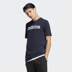 Essentials Single Jersey Linear Embroidered Logo Tee. Białe koszulki sportowe męskie Adidas, l, bez wzorów, z bawełny, bez kołnierzyka, bez ramiączek, na fitness i siłownię. Za 95.00 zł.
