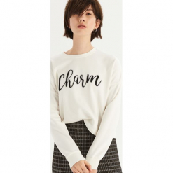 Bluza z połyskującym napisem - Kremowy. Białe bluzy damskie Sinsay, z napisami. Za 39.99 zł.