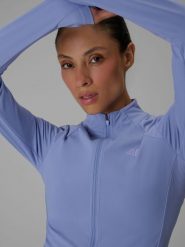 4F Bluza do jogi slim szybkoschnąca damska - niebieska XS. Niebieskie kardigany damskie 4f, l, bez wzorów, z włókna, sportowe. Za 199.99 zł.