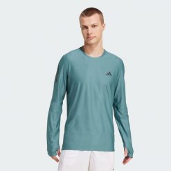 Koszulka Own The Run Long Sleeve. Niebieskie koszulki sportowe męskie Adidas, l, bez wzorów, bez kołnierzyka, bez ramiączek, do biegania. Za 191.50 zł.