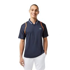 Koszulka sportowa polo męska Lacoste Polo. Niebieskie koszulki polo męskie Lacoste, l, z aplikacjami, z materiału, eleganckie, bez ramiączek. Za 327.00 zł.