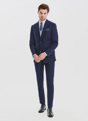 PAKO LORENTE - Granatowy garnitur męski z wełną. Niebieskie spodnie materiałowe męskie Pako Lorente, m, bez wzorów, z poliesteru, biznesowe. Za 1,739.98 zł.