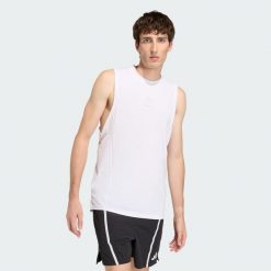 Koszulka Les Mills Graphic Tank. Białe t-shirty męskie Adidas, bez wzorów, bez kołnierzyka. Za 179.00 zł.