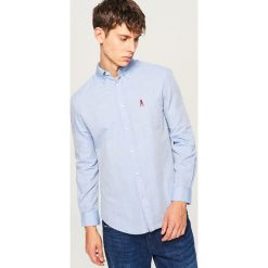 Koszula regular fit - Niebieski. Niebieskie koszule męskie Reserved. W wyprzedaży za 49.99 zł.