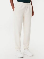 Lacoste Spodnie dresowe XF0353 Beżowy Regular Fit. Brązowe spodnie dresowe damskie Lacoste, bez wzorów, z bawełny. Za 549.99 zł.