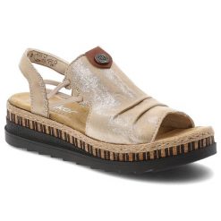 Sandały damskie Rieker, cholewka ze skóry ekologicznej z metalicznym wykończeniem wsuwany fason z elastycznymi wstawkami, beżowe, V7972-60. Brązowe sandały damskie Rieker, bez wzorów, ze skóry ekologicznej, bez obcasa, na koturnie, bez zapięcia. Za 319.00 zł.
