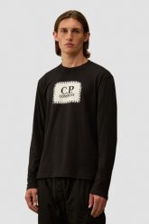 C.P. COMPANY Czarny męski longsleeve. Czarne bluzki z długim rękawem męskie C.P. Company, l, bez wzorów, z bawełny, bez kołnierzyka. W wyprzedaży za 359.99 zł.