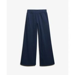 Damskie spodnie dresowe z szerokimi nogawkami Superdry Essential. Niebieskie spodnie dresowe damskie Superdry., l, bez wzorów, z dresówki, na fitness i siłownię. Za 279.65 zł.