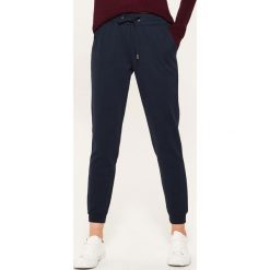 Dresowe joggery - Granatowy. Niebieskie spodnie dresowe damskie House, z dresówki. Za 59.99 zł.