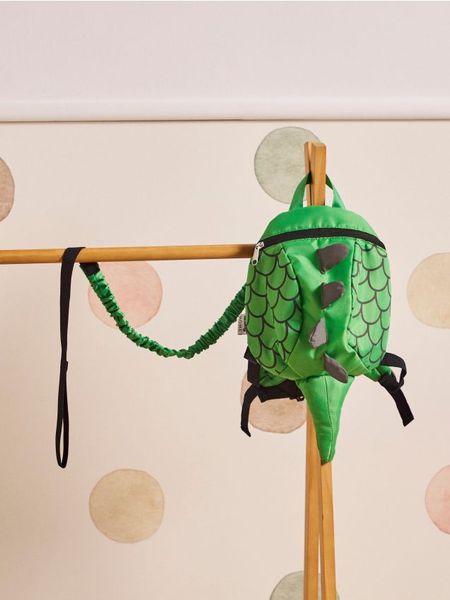 Plecak dla dziecka z szelkami i smyczą bezpieczeństwa z motywem smoka - zielony. Zielone torby i plecaki dziecięce Sinsay. Za 49.99 zł.