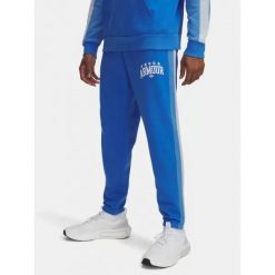 Spodnie Męskie Under Armour Dresowe Z Logo Rival Fleece Colorblock. Niebieskie spodnie sportowe męskie Under Armour, m, bez wzorów, z dresówki, do biegania. Za 249.99 zł.