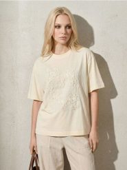 Bawełniana koszulka z kwiatową aplikacją i cekinami - żółty. Żółte t-shirty damskie Sinsay, l, z aplikacjami, z bawełny, bez kołnierzyka. Za 35.99 zł.