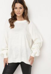 Jasnobeżowy Sweter o Kroju Oversize z Szerokimi Ściągaczami Nittia. Brązowe swetry damskie Born2be, m, bez wzorów, biznesowe, bez kołnierzyka, bez ramiączek, bez kaptura. Za 89.99 zł.