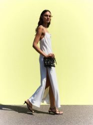 Sukienka maxi na ramiączkach - złamana biel. Sukienki damskie Reserved, l, bez wzorów, z tkaniny, bez kołnierzyka, bez ramiączek, maxi. W wyprzedaży za 119.99 zł.