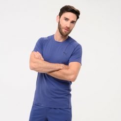 Koszulka z krótkim rękawem męska Puma Active Gym & Pilates. Niebieskie koszulki sportowe męskie Puma, l, bez wzorów, z bawełny, bez kołnierzyka, bez ramiączek, na jogę i pilates. W wyprzedaży za 49.99 zł.