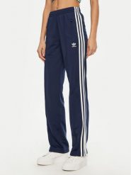 Adidas Spodnie dresowe adicolor Classics Firebird JC8285 Granatowy Regular Fit. Niebieskie spodnie dresowe damskie Adidas, xl, bez wzorów, z dresówki. Za 219.99 zł.