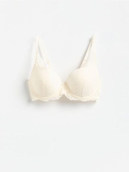 Biustonosz push up z koronką - złamana biel. Biustonosze Reserved, bez wzorów, z dzianiny. Za 69.99 zł.