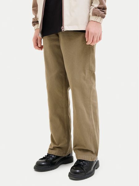 Jack & Jones Junior Spodnie materiałowe Alex 12253790 Brązowy Loose Fit. Brązowe spodnie materiałowe dla chłopców Jack & Jones Junior, bez wzorów, z bawełny. Za 119.99 zł.